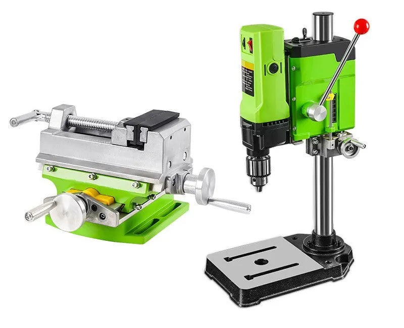 Bench-mounted drilling and milling machine with motor, chuck, and adjustable work table.