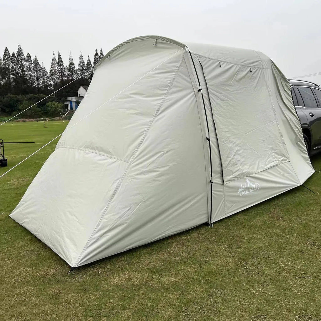 Car tail extension tent set up at a campsite with rear access, showing 190T silver-coated anti-UV fabric and screen windows.