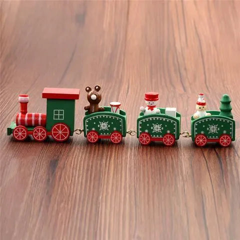 Four mini wood train cars in red, white, and green paint linked together on a shelf