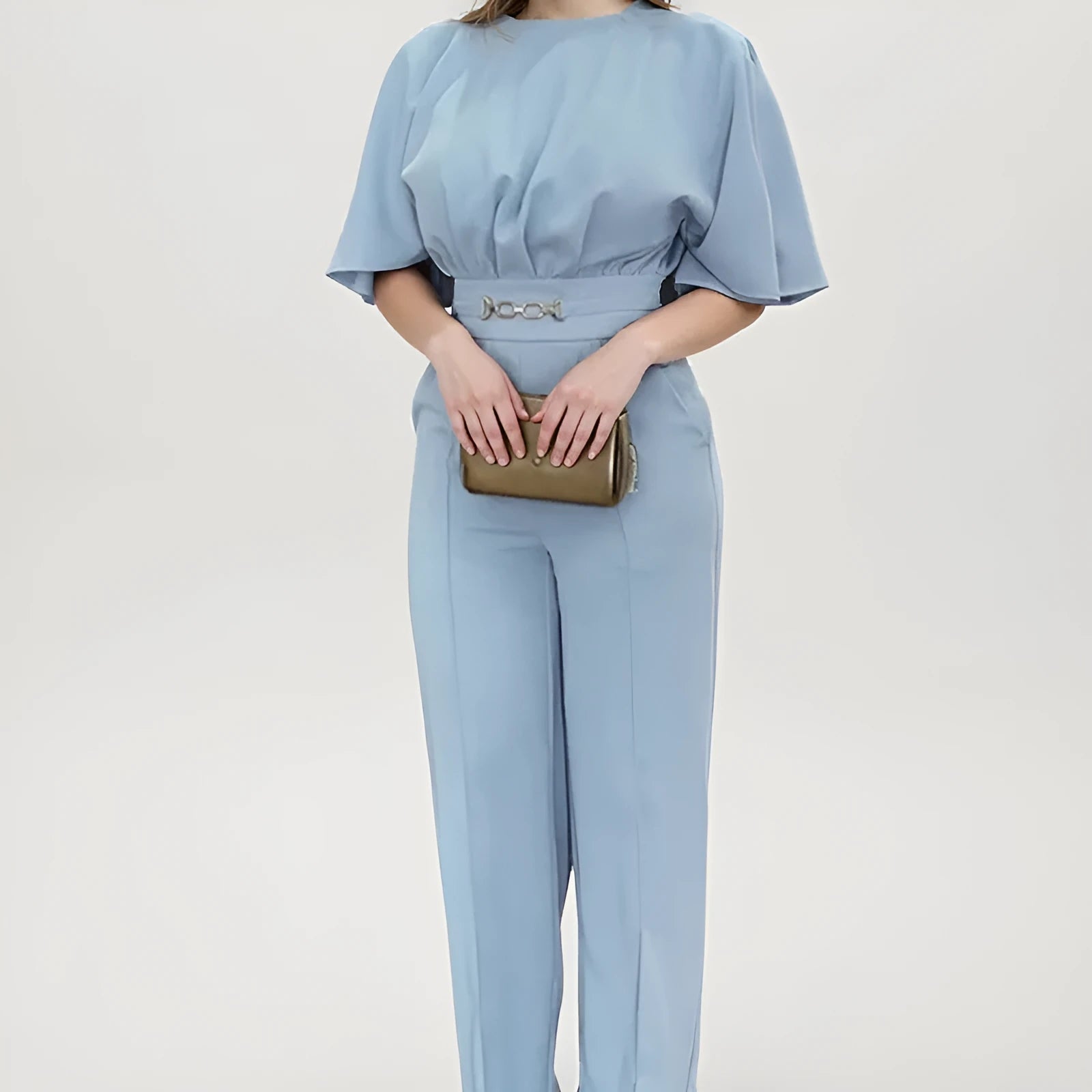 Blue men's polyester casual suit set with long sleeves and trousers on a hanger.