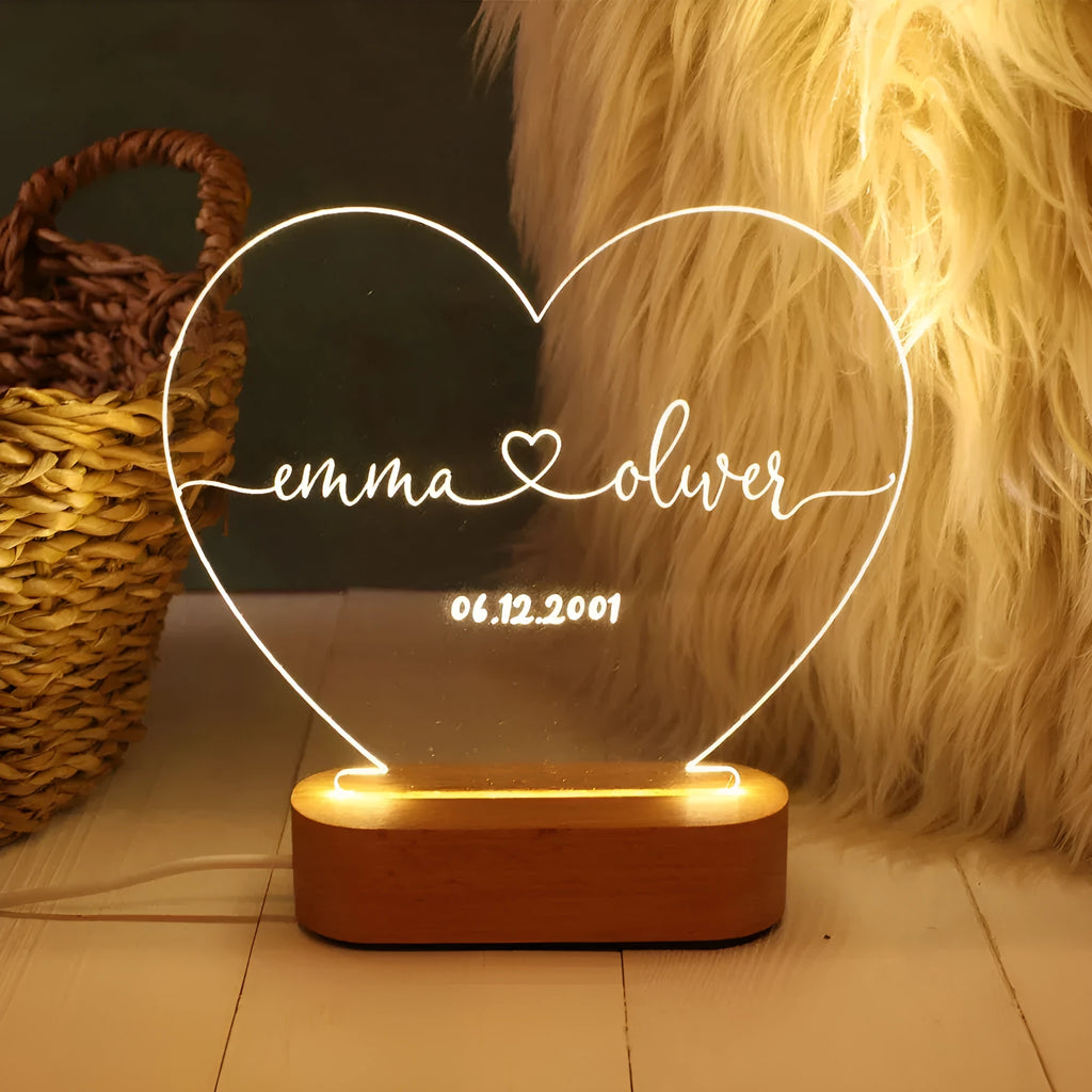 Personalised acrylic LED night light showing custom names and dates with transparent 20x11.5cm design