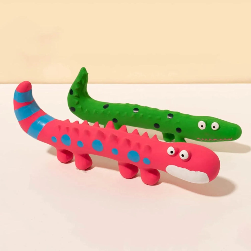 Green cartoon lizard shaped dog chew toy with squeaker on a white background.