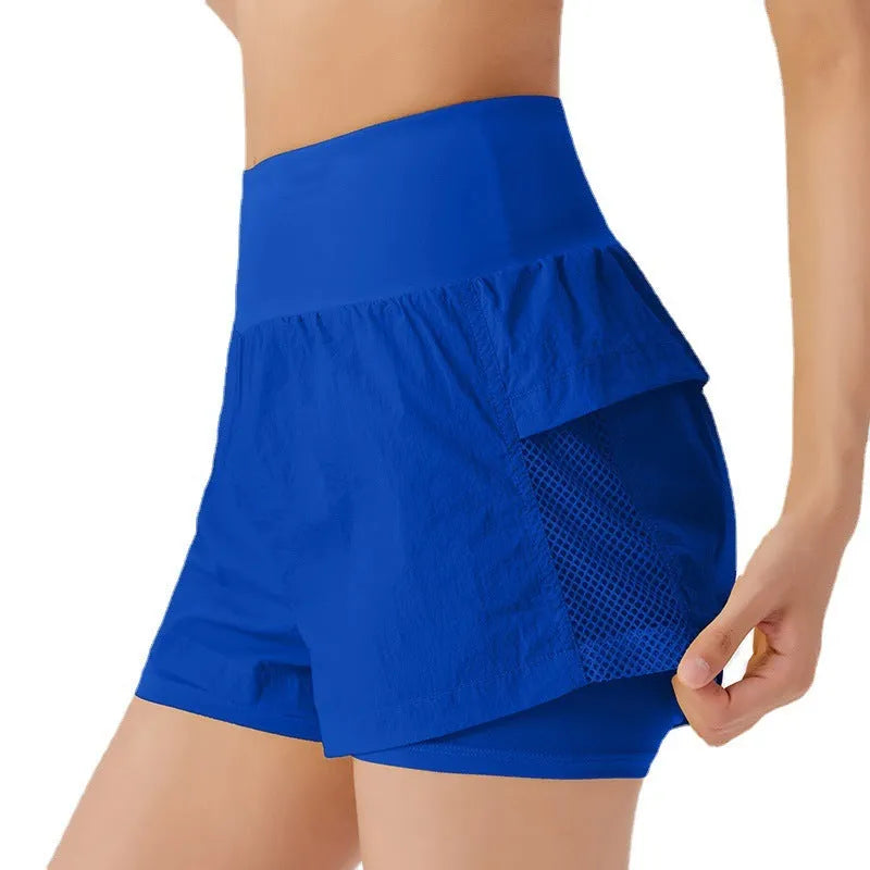 Women's loose cotton blend quick-drying sports shorts in lemon yellow on a mannequin