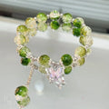 Chinese style glass bead bracelet with bamboo leaf design and manual craftsmanship details.