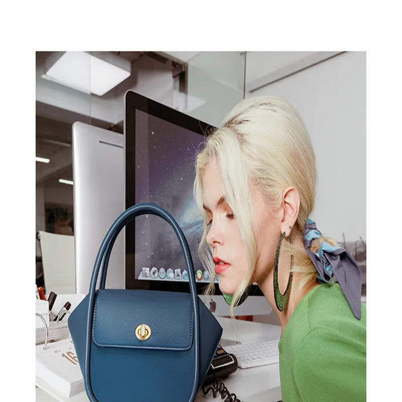 Genuine cow leather wing-shaped tote bag with buckle detail and cross-body shoulder strap