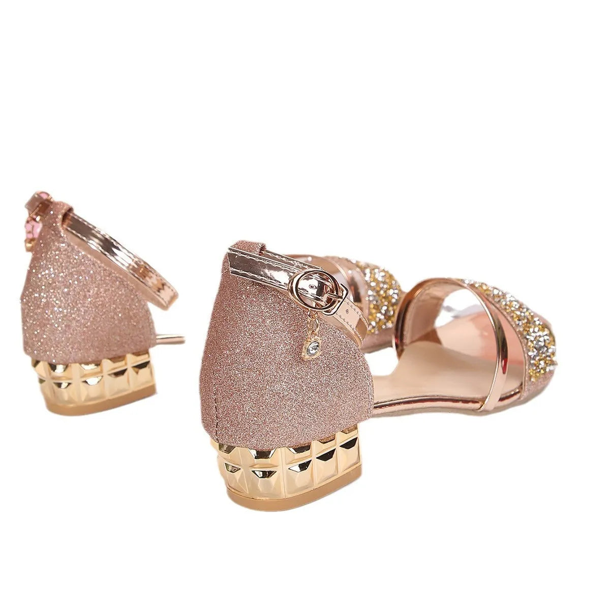 Women's metallic Roman sandals with rhinestone buckle strap on a rubber sole.