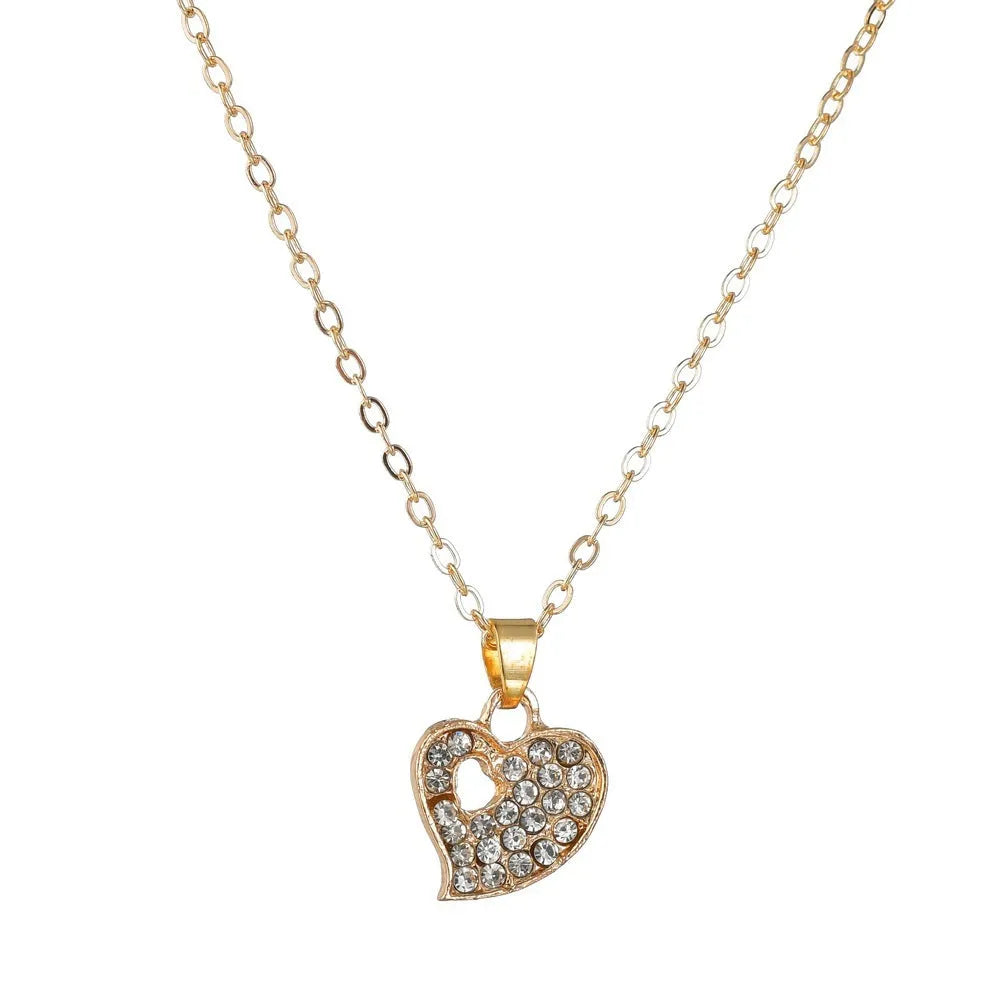 Gold-plated alloy women's jewellery set with earrings, necklace, and bracelet featuring love, water drop, and bell pendants.
