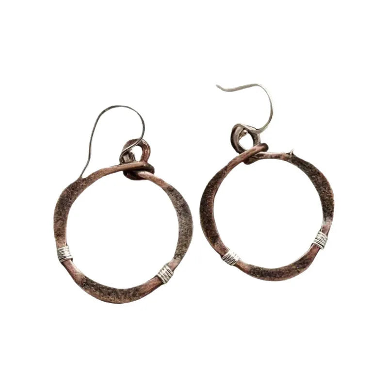 Retro hollow round bohemian earrings with bronze finish cable trim on female ear