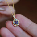 Golden women's necklace with mixed gemstone pendant on adjustable box chain