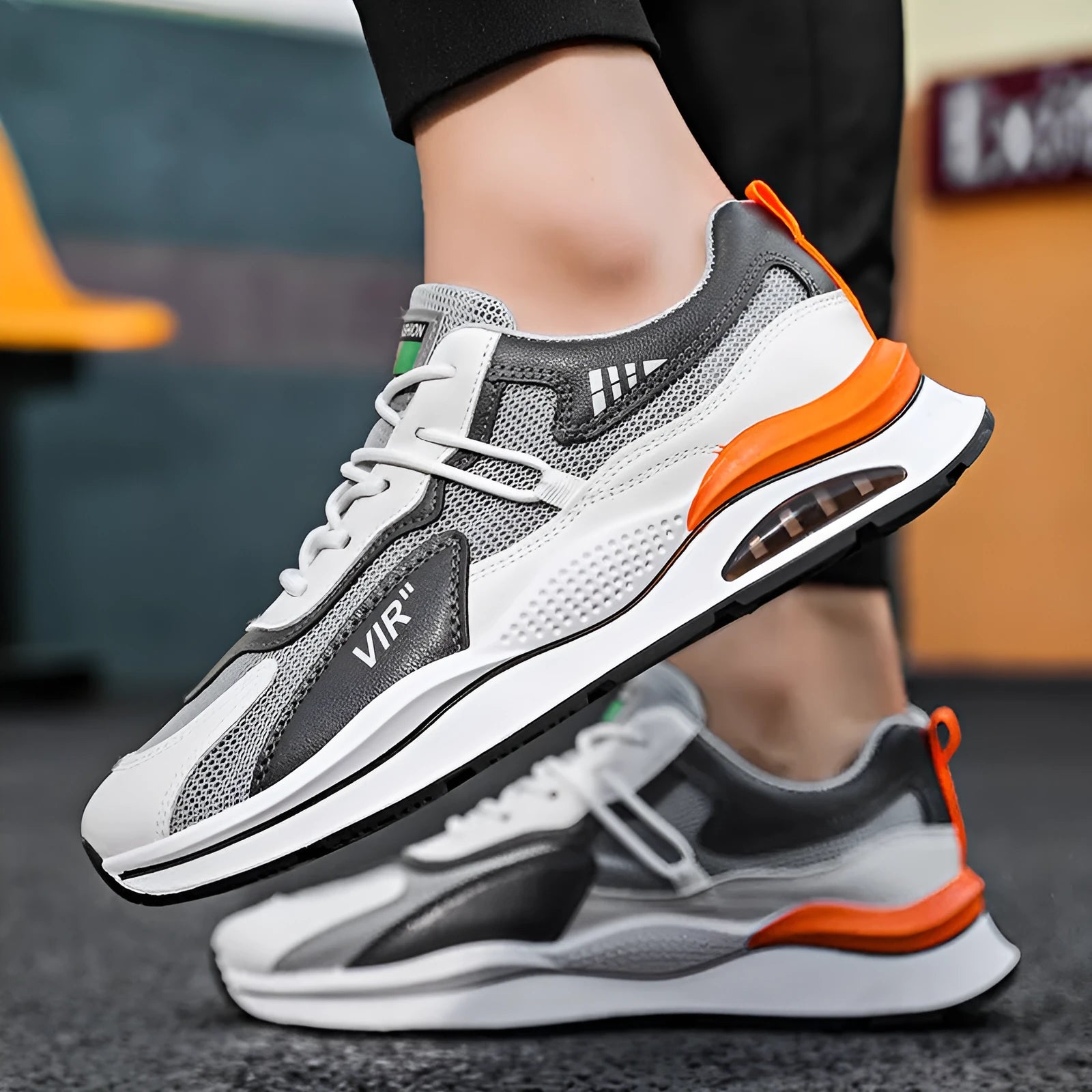 Men's grey and black mesh casual running shoes with a lightning graphic and round toe.
