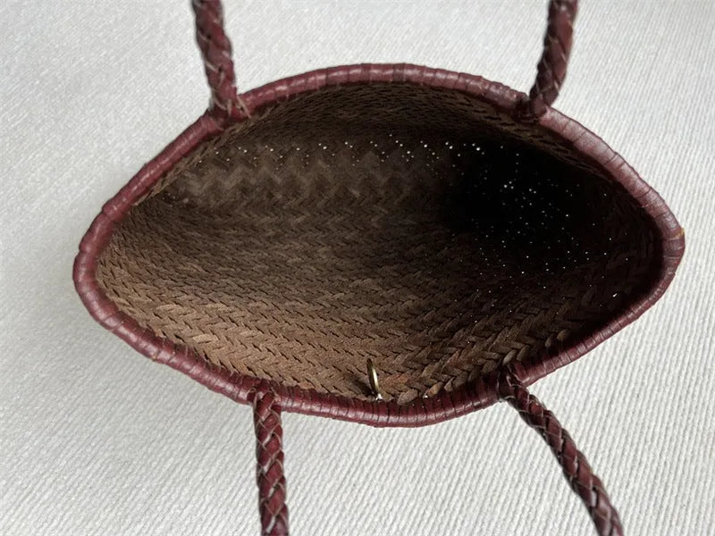 Brown woven leather tote bag with three-dimensional pockets and shoulder straps