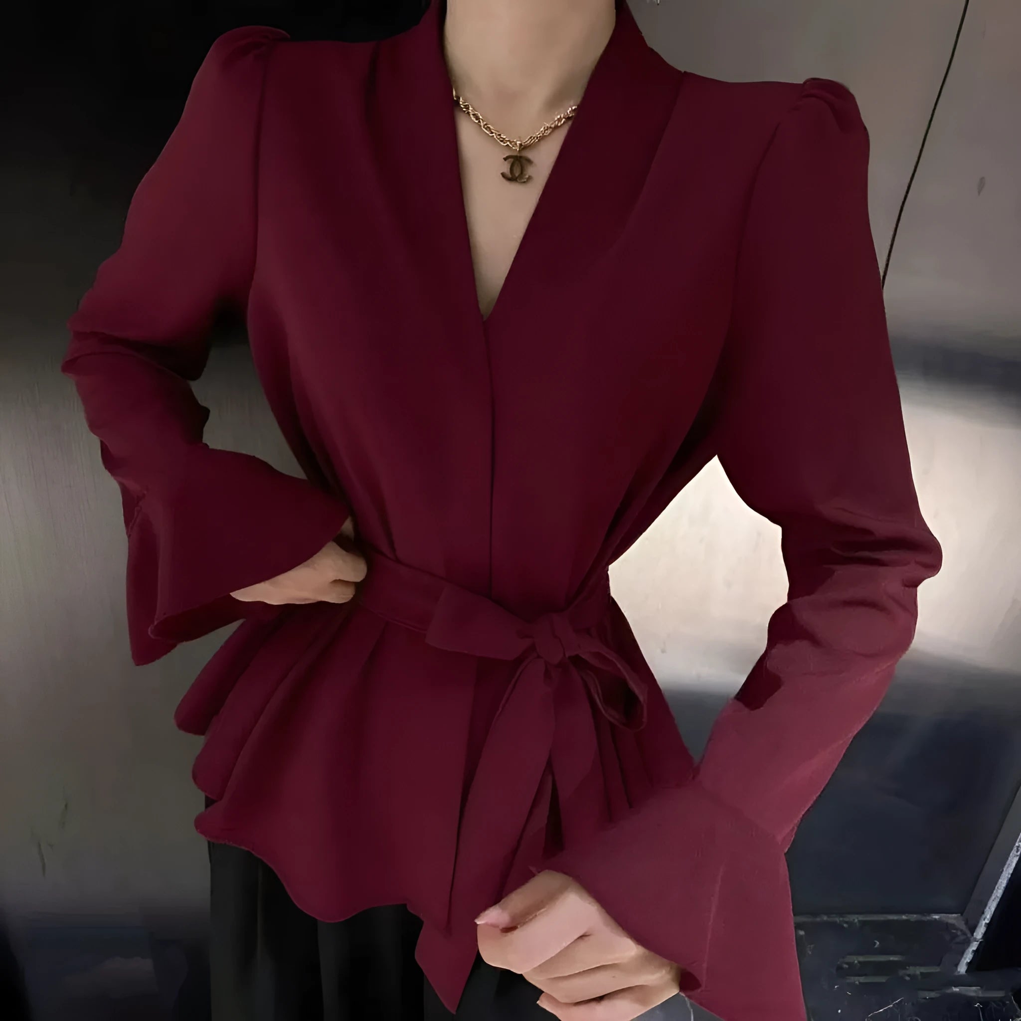 Women's French-style shirt with irregular collar and tied front in polyester fabric with bell sleeves