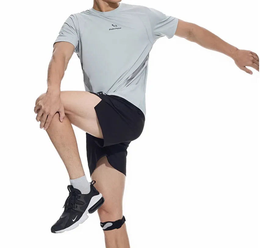 Black running shorts with laser-punched stitching and four-sided stretch fabric laid flat.