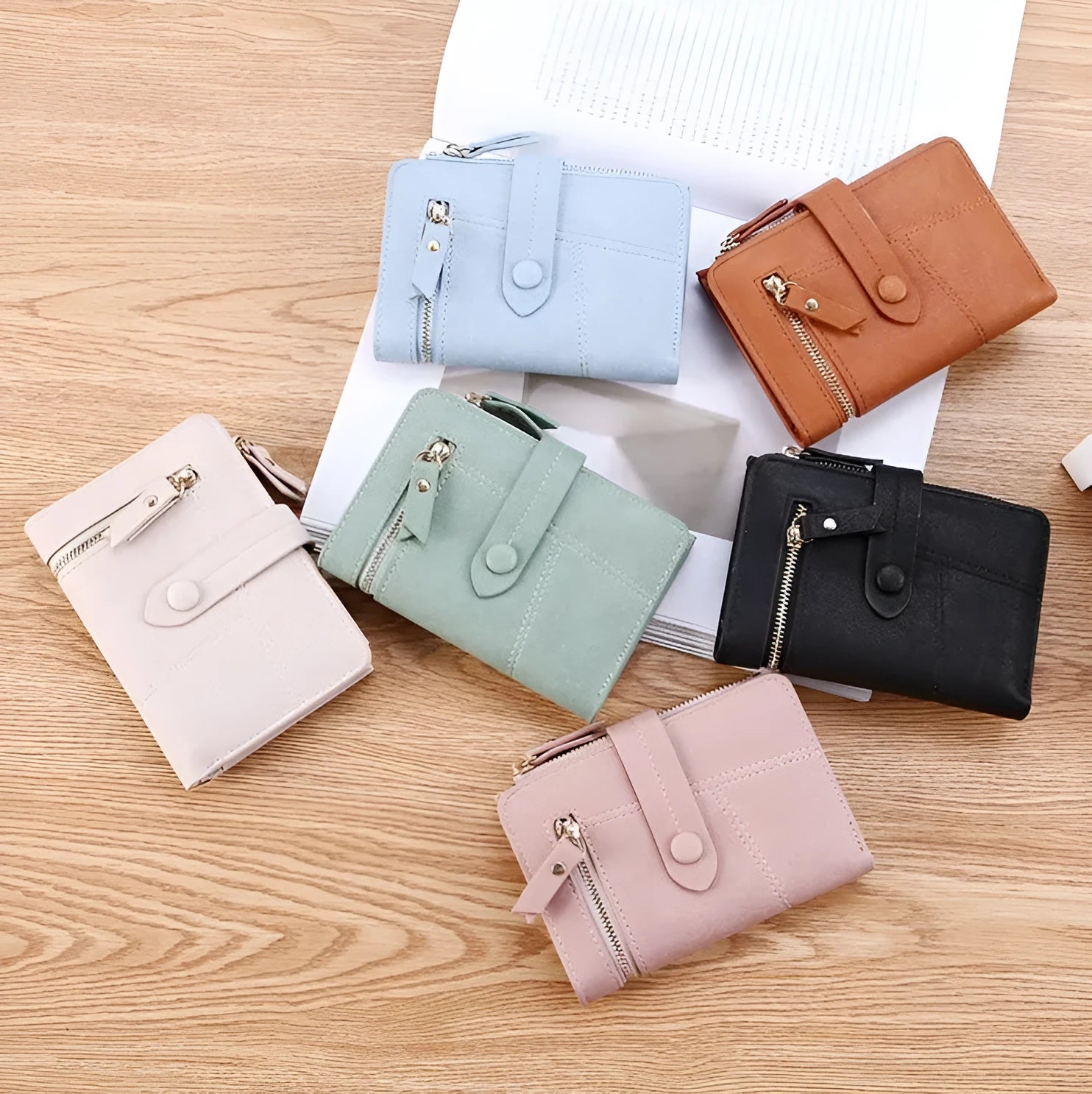 Vegan woman faux leather short wallet with zipper closure in solid colour, showing interior with bill and card compartments