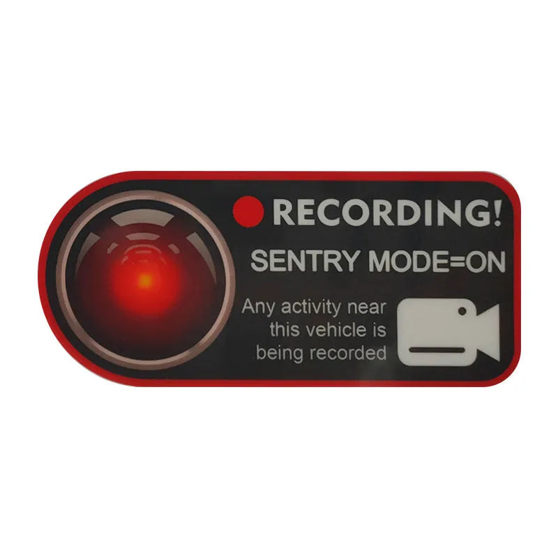 Two white electrostatic warning stickers for Tesla Sentry Mode, each measuring 11 by 5 centimetres.