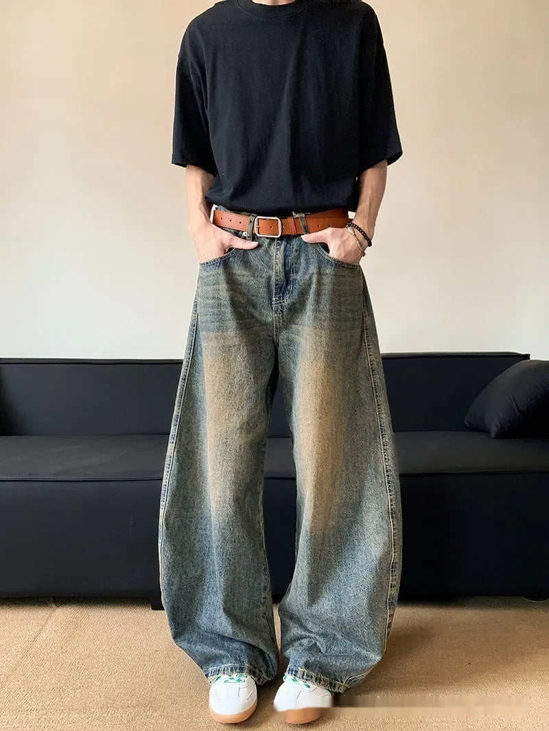 Men's retro blue distressed denim jeans with slim wide-leg fit showing micro elasticity fabric