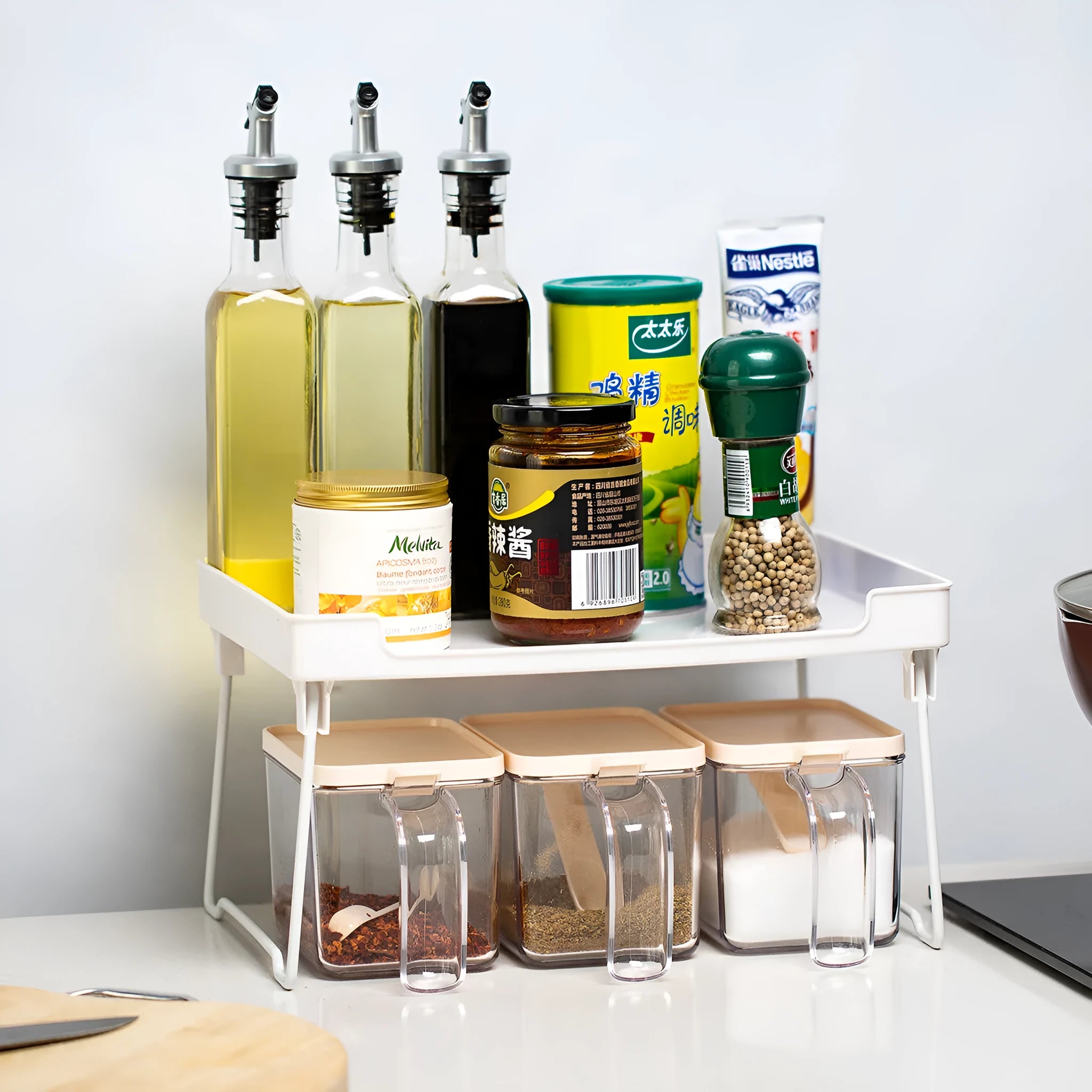 Plastic kitchen supplies rack for organising utensils on desktop or in cupboard storage