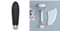 Natural white jade double-headed facial roller and gua sha board set on a plain background.