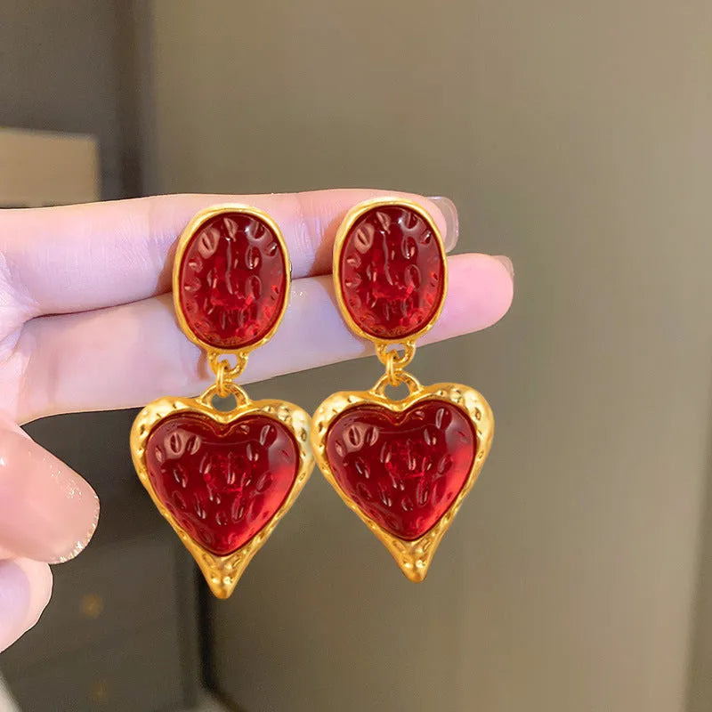 Silver needle pleated oval love heart alloy stud earrings in purple, red, green, and yellow and white colours.