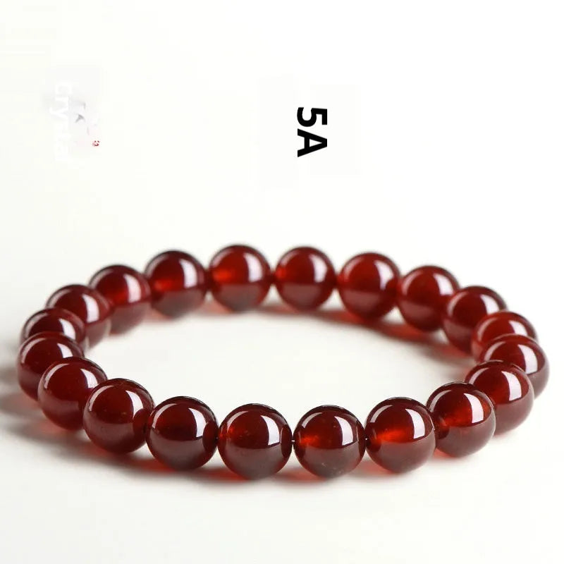 Natural orange red garnet crystal ball bracelet with ruyi charm detail in retro unisex style