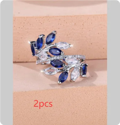 Adjustable horse eye design leaf ring in copper with zircon crystals, shown in a rose gold finish