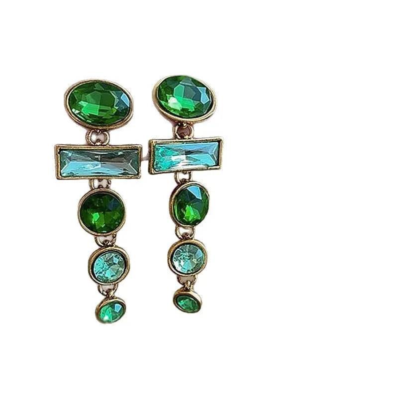 A pair of green gradient alloy earrings with geometric shapes, inlaid zircon stones, and decorative tassels.