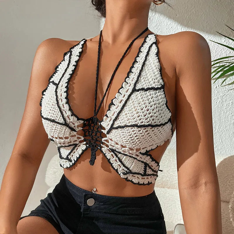 Women's classic black and white bikini swimsuit on a hanger.