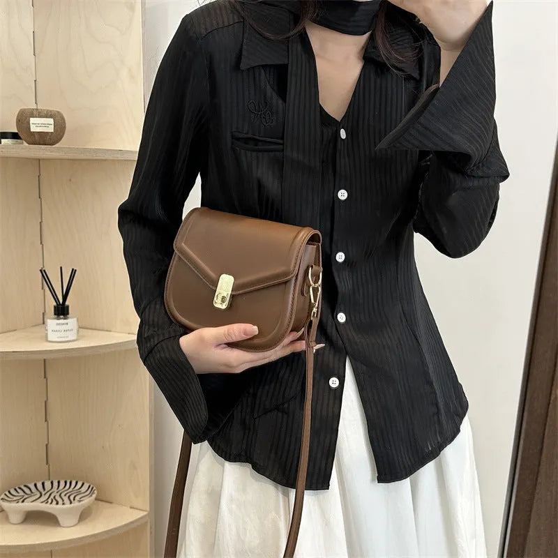 Soft PU leather messenger bag in clam shell design, shown in a horizontal square shape with a shoulder strap.