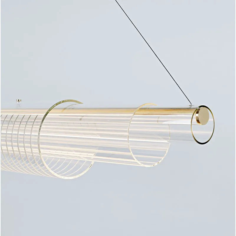 Modern minimalist glass pendant lamp with iron fittings and LED light in three length options.