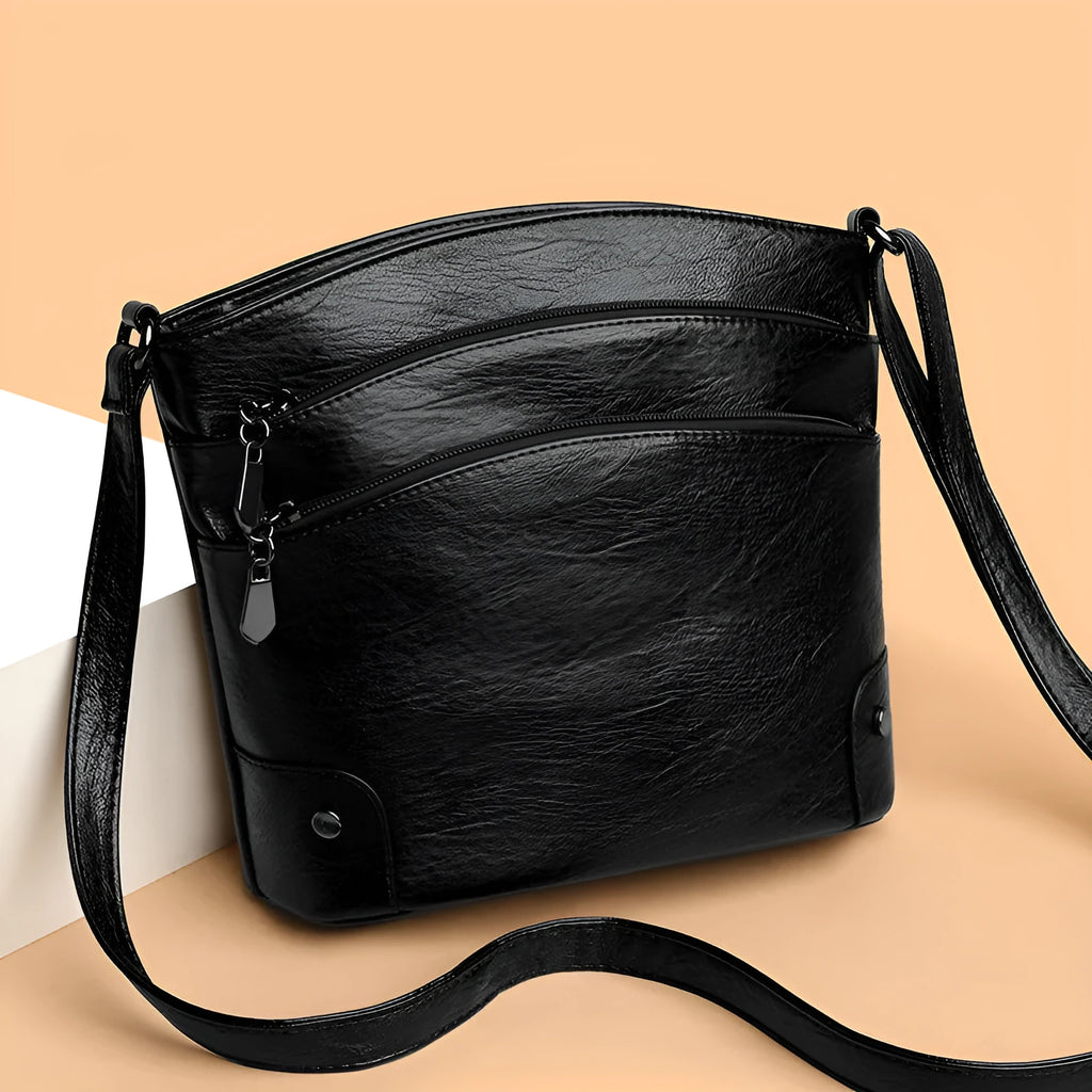 Large capacity multi-layer bucket bag in available colours including black, brown, and green