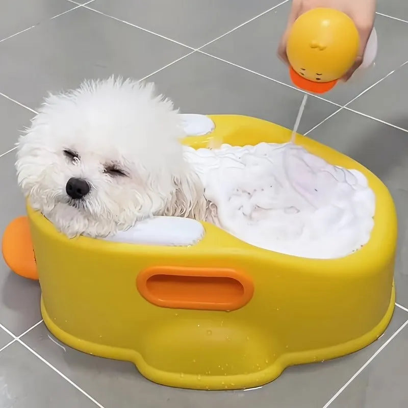 Blue PVC duck-shaped bathtub for washing a small dog or cat.