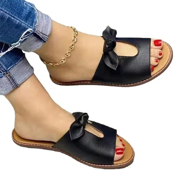 Women's black sandals with a fish mouth toe and decorative bow on the upper