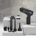 Black wireless car and home vacuum cleaner with accessories including brush heads and nozzles