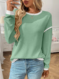 Women's loose round neck polyester pullover top in light blue colour with long sleeves