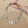 Emerald green Tian Shan Cui jade bracelet with floating flower girl half design and round elements