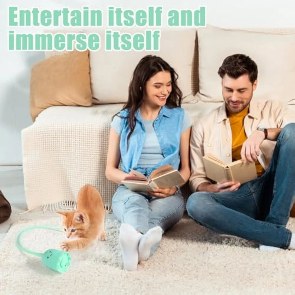 Rechargeable automatic cat toy with motorised swinging silicone tail on green background