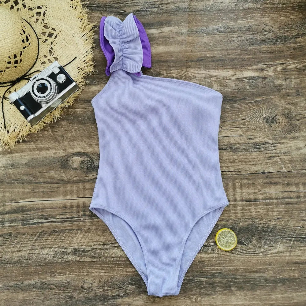 Women's single-shoulder suspender tube top one-piece swimsuit in a high-waisted style.