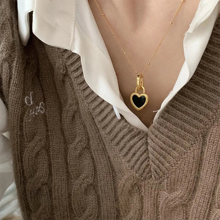 Double-sided shell love pendant necklace with mixed gem inlay on adjustable chain, available in gold-plated copper or titanium steel