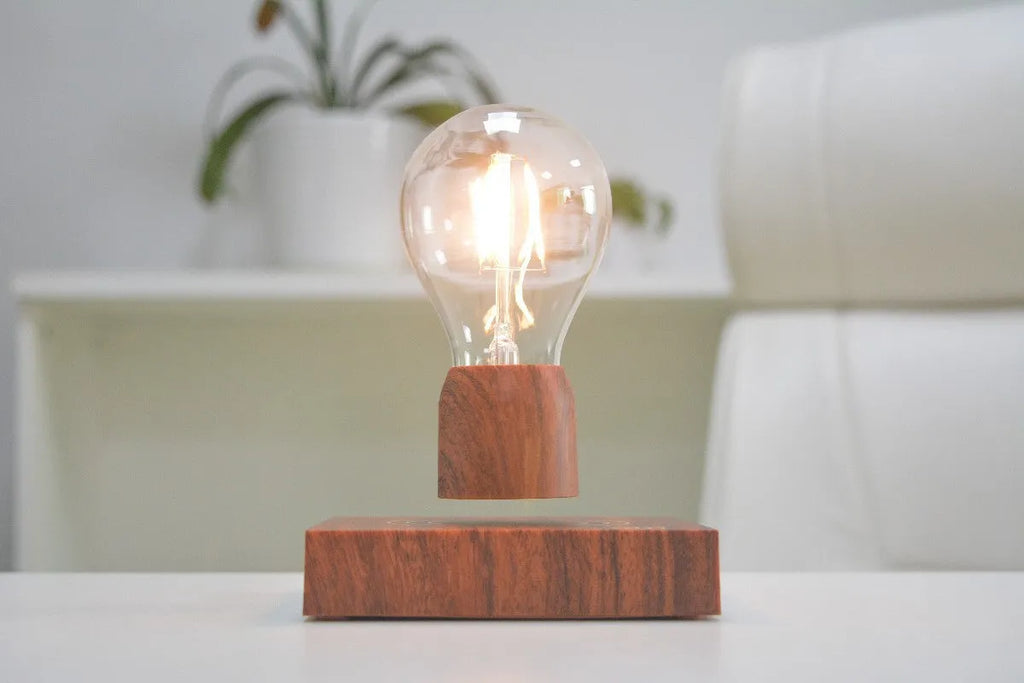 Magnetic levitation floating light bulb on imitation wood base with choice of international plugs.
