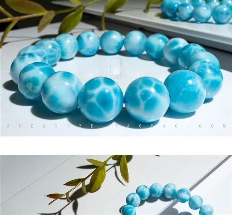 Unisex blue pearl and natural crystal sea-pattern stone bodhi bracelet on a wrist, showing Maillard style design.