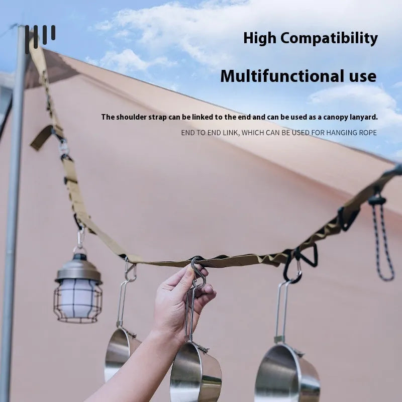 130cm black nylon outdoor hanging strap secured between two trees with laundry drying