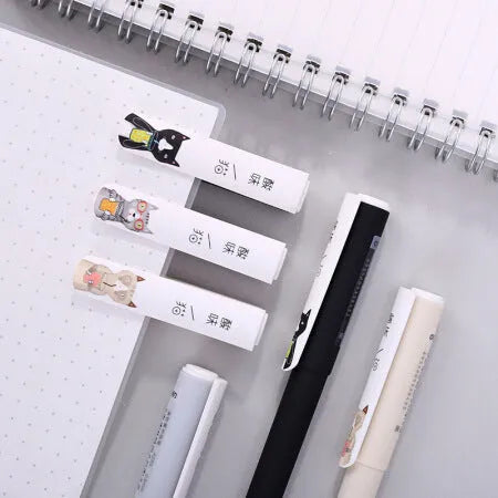 Black gel pen with full needle tube design on white surface, plastic body, cap on