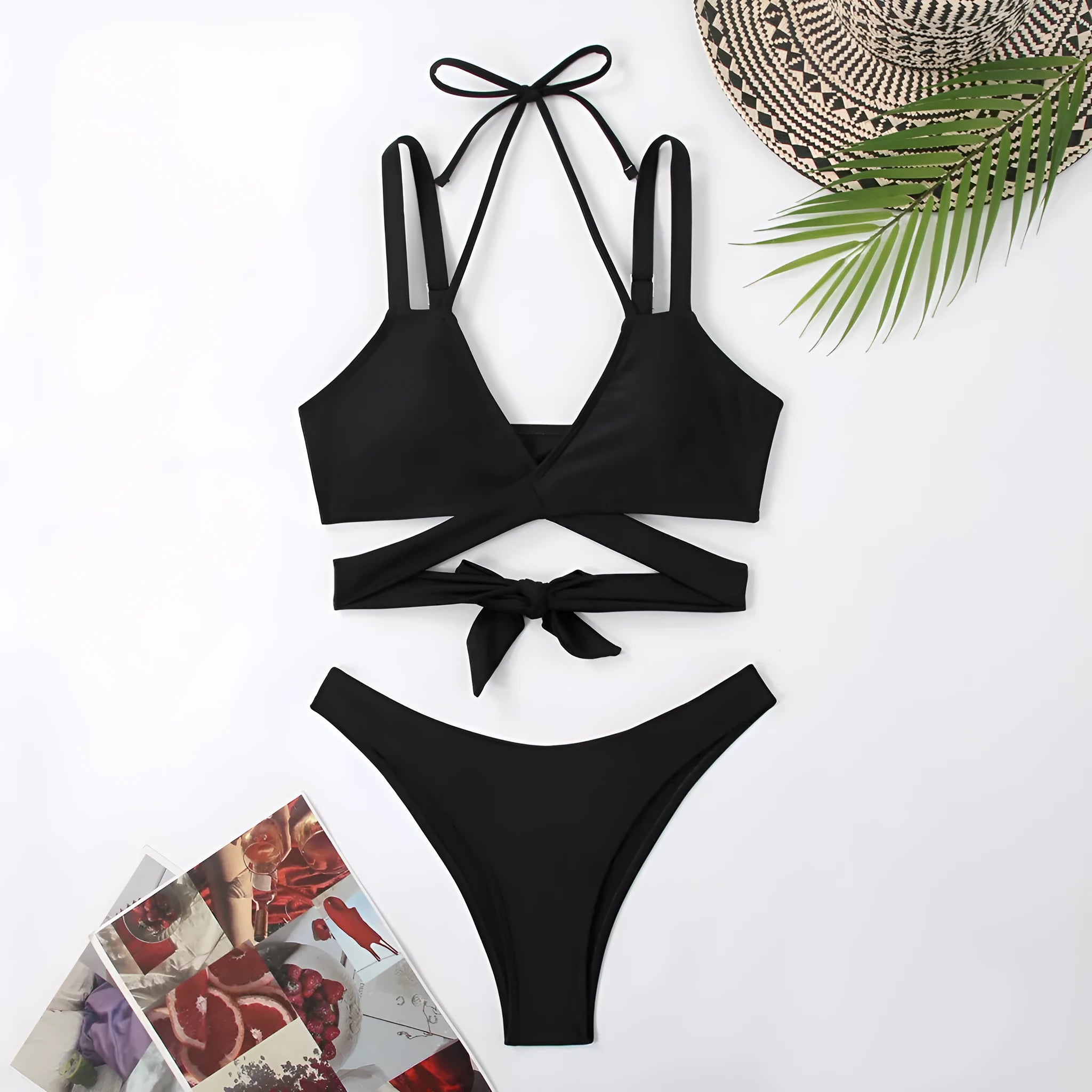 Women's solid colour strappy bikini swimsuit in black, blue, red, rose red, or white on a mannequin.