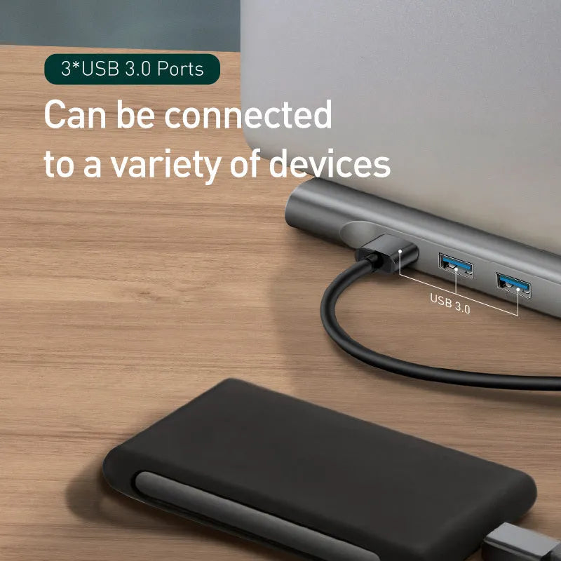 Aluminium ten-port laptop docking station and cooling hub showing HDMI, USB, and Ethernet ports.