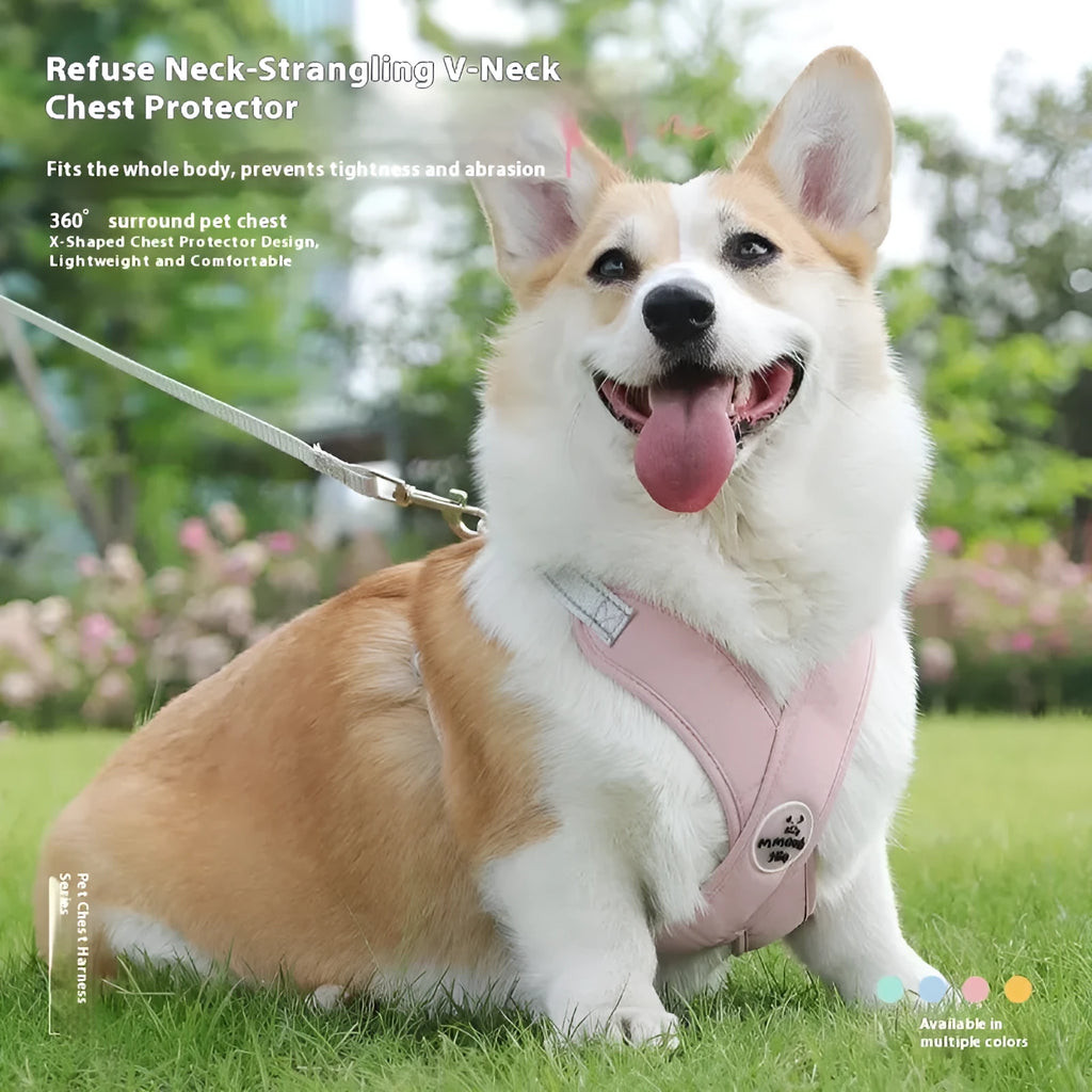 Pink dog vest harness with attached hand holding rope on a white background