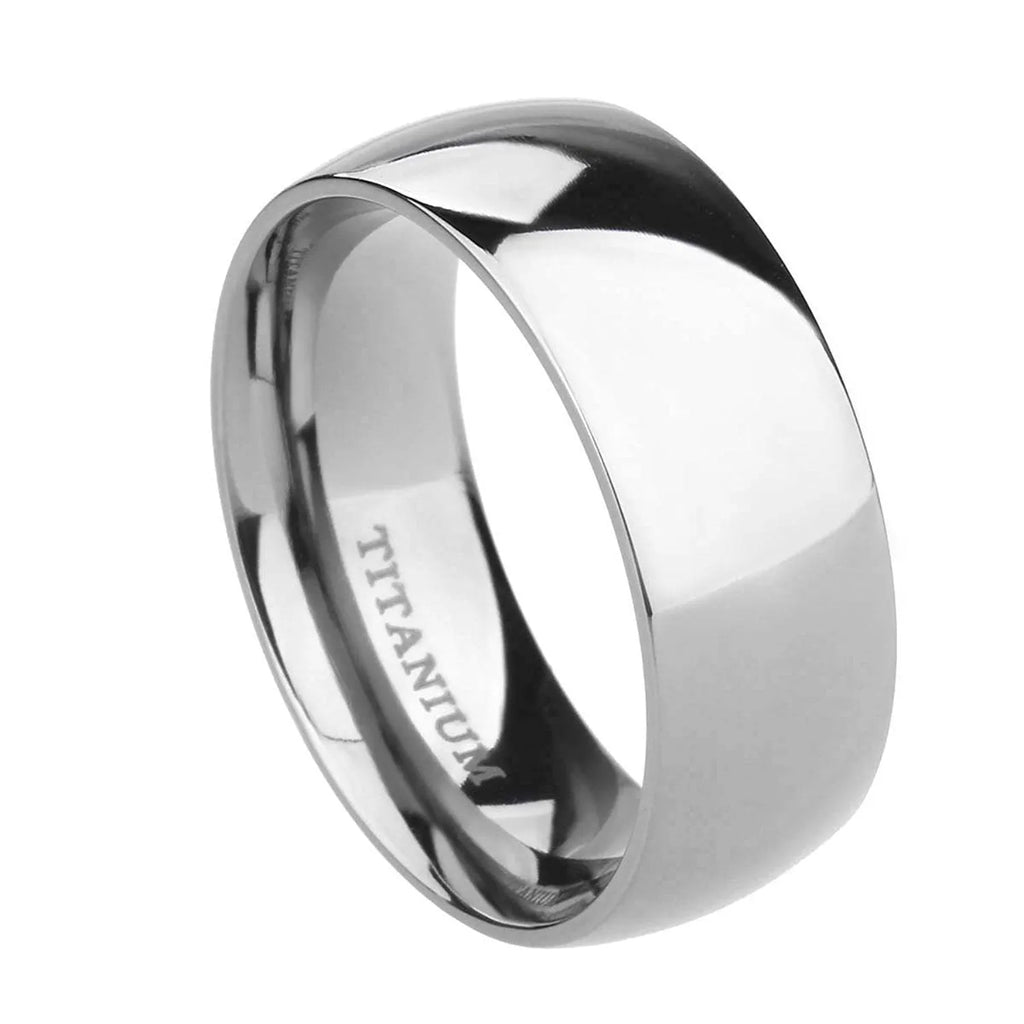 A simple silver titanium steel ring on a finger, showing the band's width and uniform ground finish.