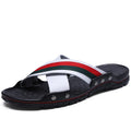 Men's leather flip-flop sandals in white, blue, and black on a beach background, showing cowhide upper and PU sole.