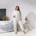 Women's milky white polyester trousersuit with crew neck top and matching trousers