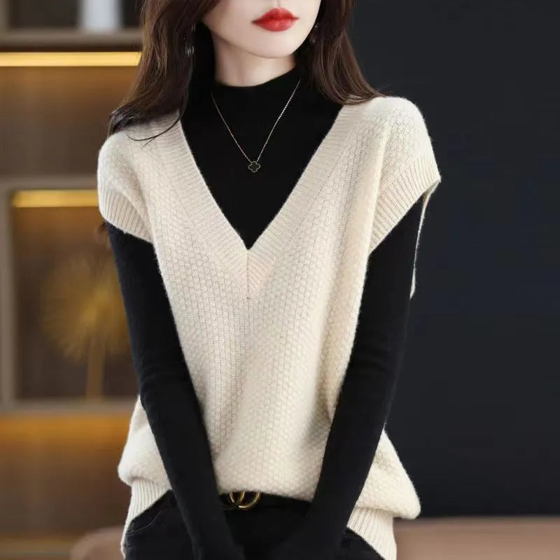 Women's V-neck sleeveless knitted vest with 3D pattern in acrylic fibre