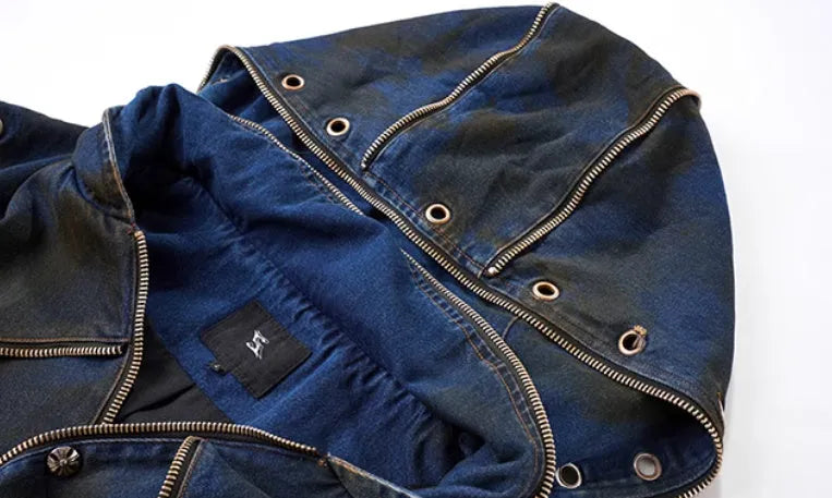 Blue heavy industry style hooded denim vest coat with matching trousers laid flat.